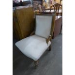 An Edward VII walnut and upholstered nursing chair