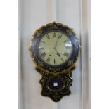 A Victorian lacquered papier mache and mother of pearl inlaid wall clock