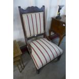 An Edward VII carved mahogany and upholstered chair