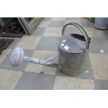 A galvanised watering can