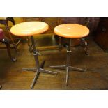 A pair of vintage metal based stools