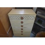 A teak effect chest of six drawers