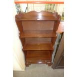 A mahogany waterfall bookcase