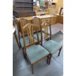 A set of four Nathan teak dining chairs