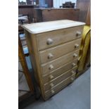 A pine chest of drawers