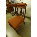 An Edward VII inlaid mahogany and upholstered nursing chair
