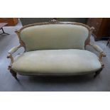 A Victorian walnut and upholstered settee