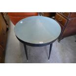 A circular dish topped table