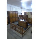 A French carved oak five piece bedroom suite