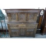 An Elizabeth I style carved oak court cupboard