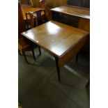 A teak cocktail cabinet and drop-leaf table