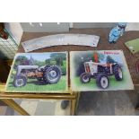 Two tin tractor signs