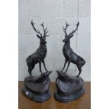 A pair of French style bronze stags, manner of J.