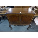 A 1920's walnut cocktail cabinet