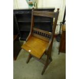 A Victorian oak folding chair