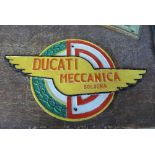 A reproduction cast iron Ducati sign