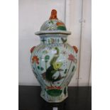 A Chinese famille vert octagonal vase and cover