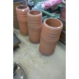 Three terracotta chimney pots