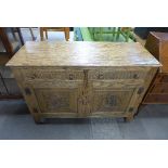 A carved oak sideboard