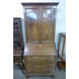 A George III inlaid mahogany bookcase on stand