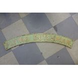 A reproduction cast iron Flying Dutchman locomotive sign