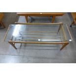 A teak and glass coffee table