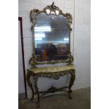 A rococo style carved giltwood and onyx console table and mirror