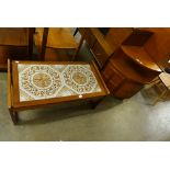 A teak corner cabinet and teak and tiled top coffee table
