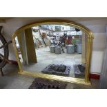 A gilt framed overmantel mirror