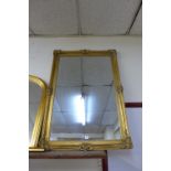 A gilt framed mirror