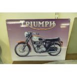 A reproduction tin Triumph sign