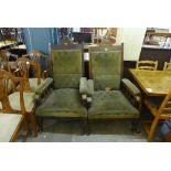 A pair of Arts and Crafts walnut and upholstered open armchairs,