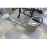 A galvanised watering can