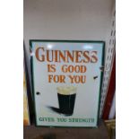 A reproduction tin Guinness sign