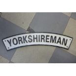 A reproduction cast iron Yorkshireman locomotive sign