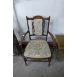 An Edward VII inlaid mahogany armchair