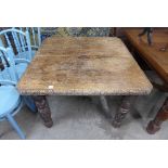 A Victorian carved oak extending dining table