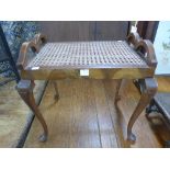 A walnut and bergere piano stool