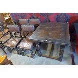 An oak draw-leaf table and four chairs