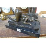 A bronze erotic female nude,