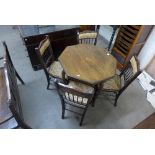 An Edward VII inlaid mahogany octagonal centre table and four chairs