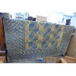 A large Afghan blue and gold ground rug