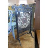 An Edward VII ebonised embroidered firescreen