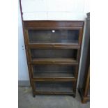 An oak four tier sectional stacking bookcase