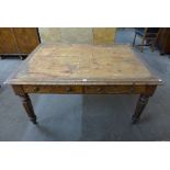A Victorian oak dining table with four drawers