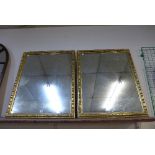 A pair of 19th Century carved giltwood mirrors