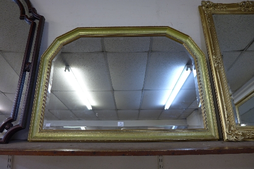 A gilt framed overmantel mirror