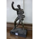 A French style bronze of an athlete wrestling a python, manner of Masse,