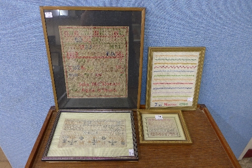 Four framed needlework samplers