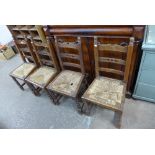 A set of four French elm dining chairs